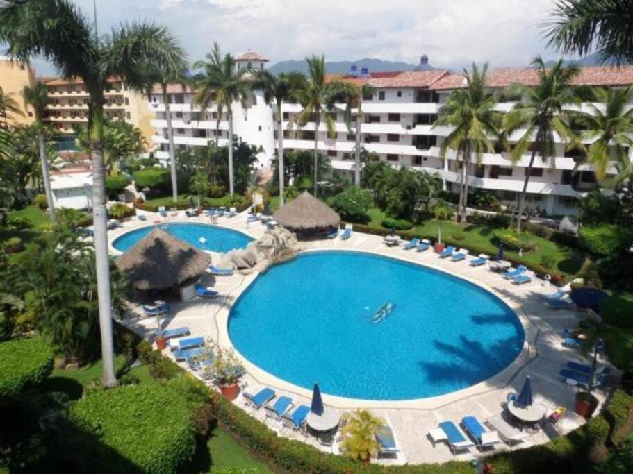 an overhead view of a swimming pool at a resort at NEW Royal Pacific Condo 2 Pools Tennis Marina in Puerto Vallarta
