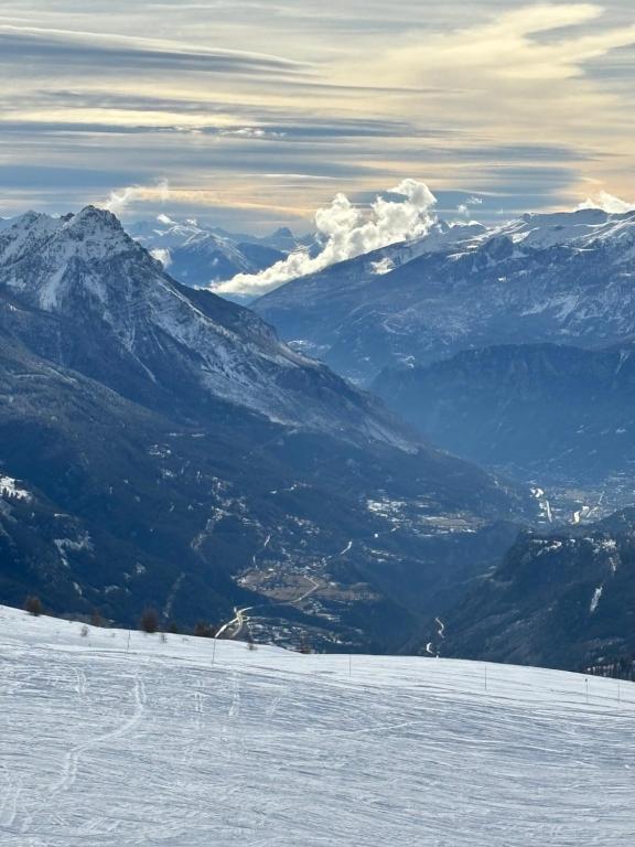 a view of a snow covered mountain with a ski slope at Hôtel Vauban Briançon Serre Chevalier in Briançon