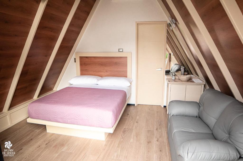 Postel nebo postele na pokoji v ubytování RIO HOTEL Y GLAMPING