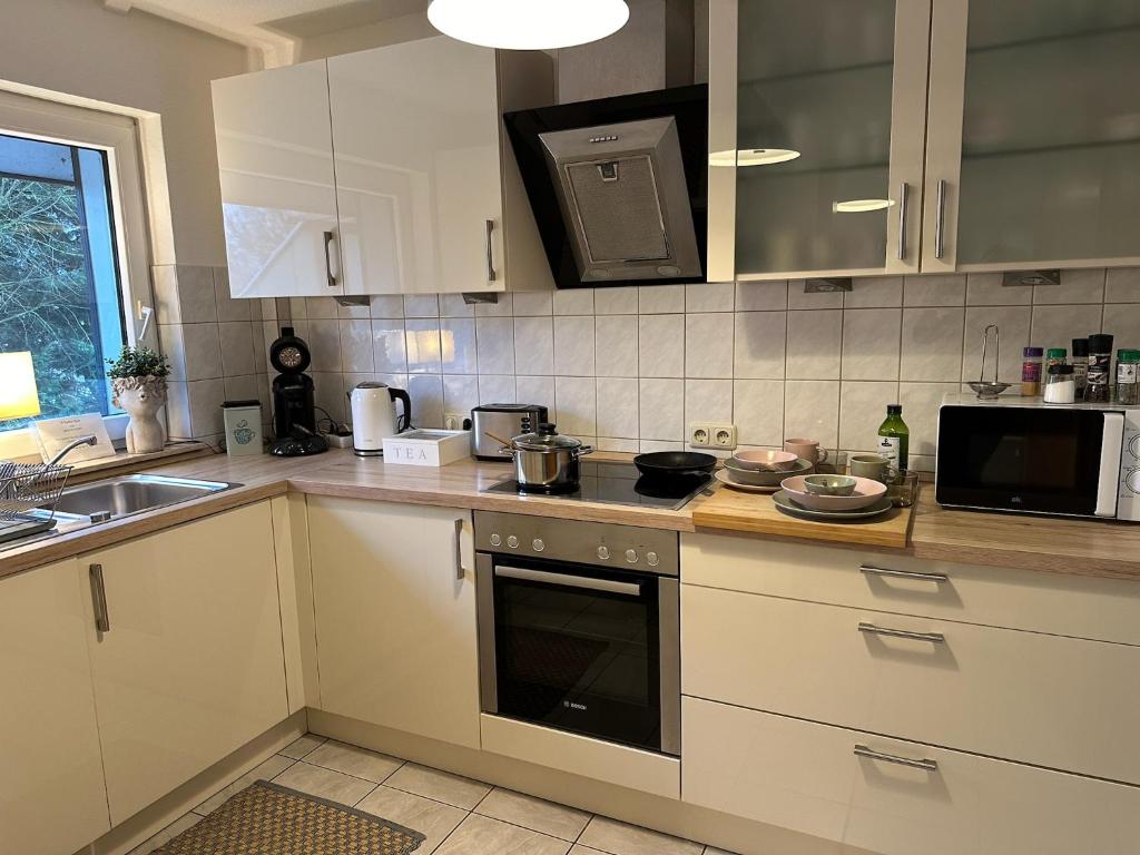 Kuchyň nebo kuchyňský kout v ubytování Hansecottage