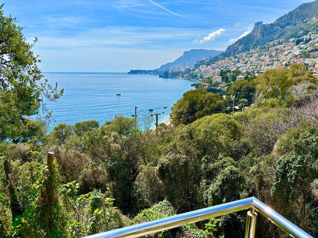 a view of a body of water from a hill at Laureto BnB in Roquebrune-Cap-Martin