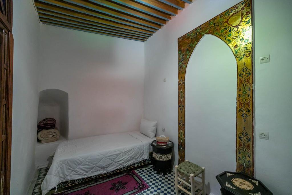 Postel nebo postele na pokoji v ubytování RIAD DAR DIWAN