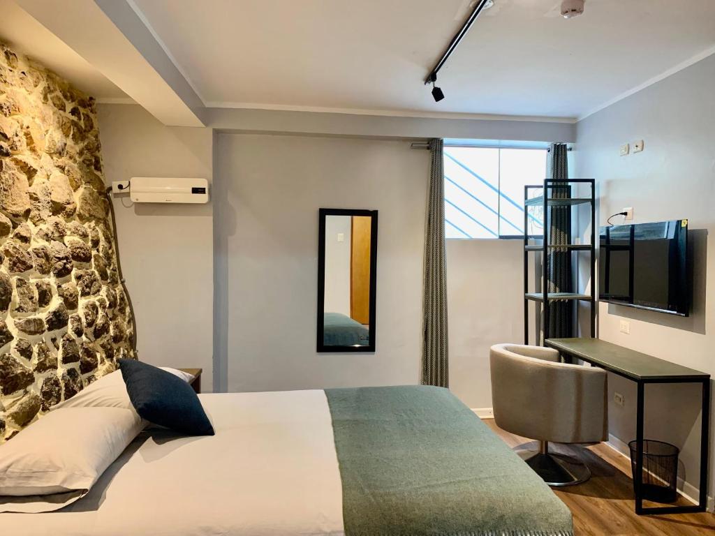 Postel nebo postele na pokoji v ubytování Casa Encuentro San Blas