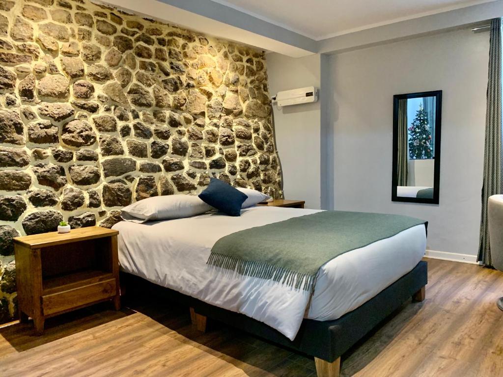 Postel nebo postele na pokoji v ubytování Casa Encuentro San Blas