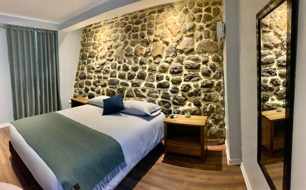 Postel nebo postele na pokoji v ubytování Casa Encuentro San Blas