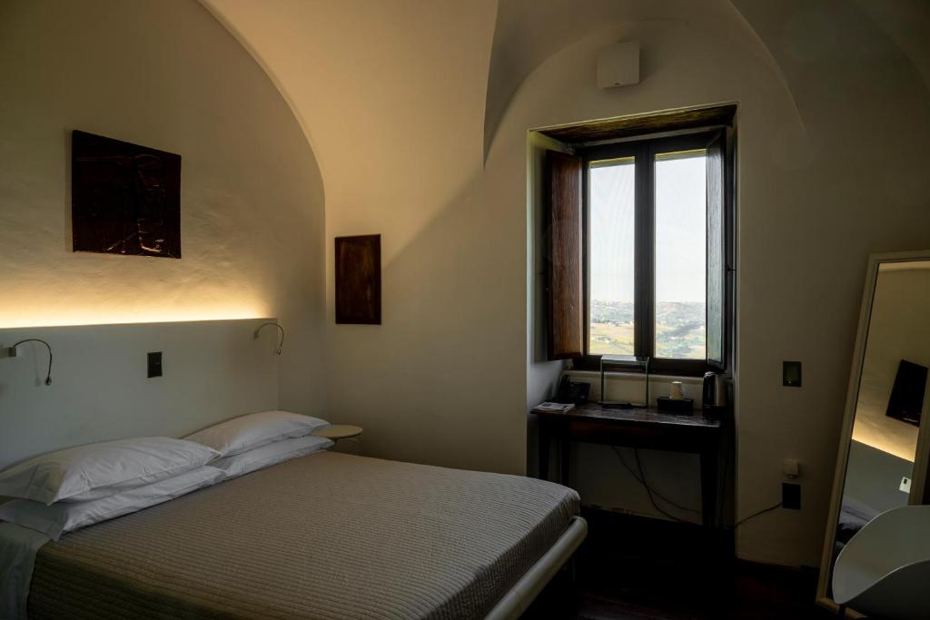 Postel nebo postele na pokoji v ubytování Castello Di Semivicoli