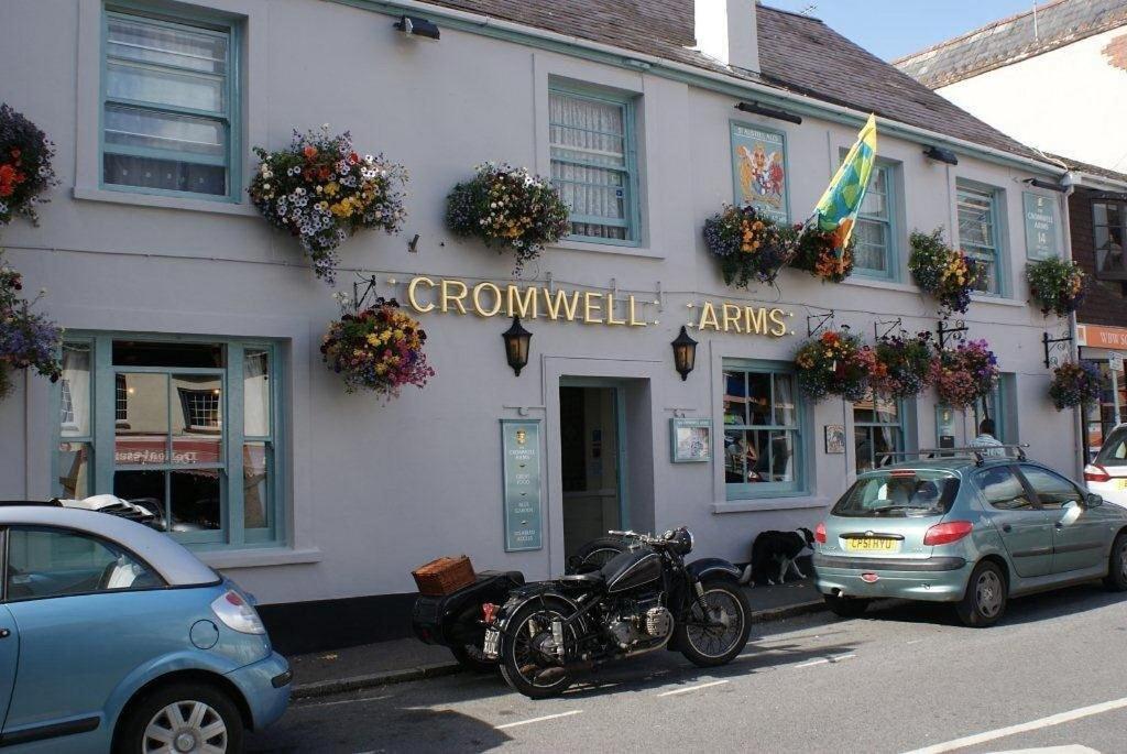 a motorcycle parked in front of a building at The Cromwell Arms Inn in Bovey Tracey