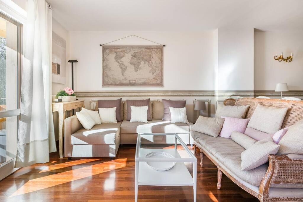 a living room with a couch and a table at Spacious, Air Conditioner, Few Minutes to the Castle in Malcesine