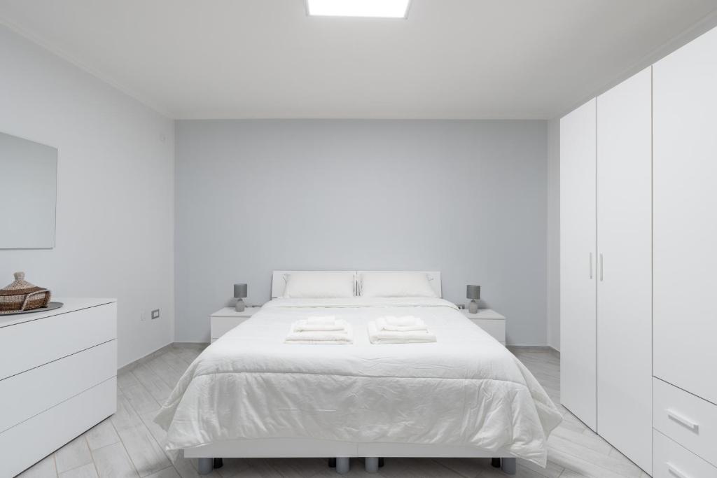 En eller flere senge i et værelse på Centro Storico - Appartamento comodo e tranquillo per 4 persone