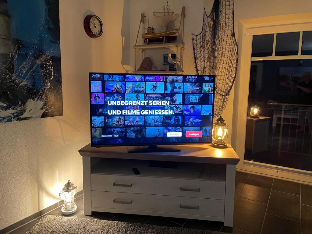 TV a/nebo společenská místnost v ubytování GrachtenGlück