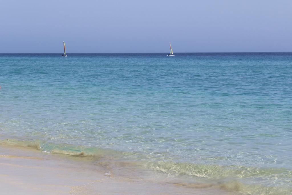 a view of the ocean with boats in the water at XQ El Palacete in Morro del Jable