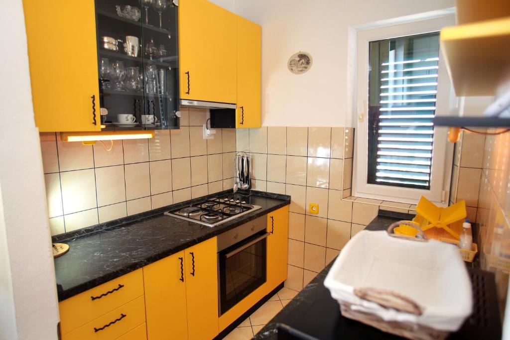 Kuchyň nebo kuchyňský kout v ubytování Rooms Carija
