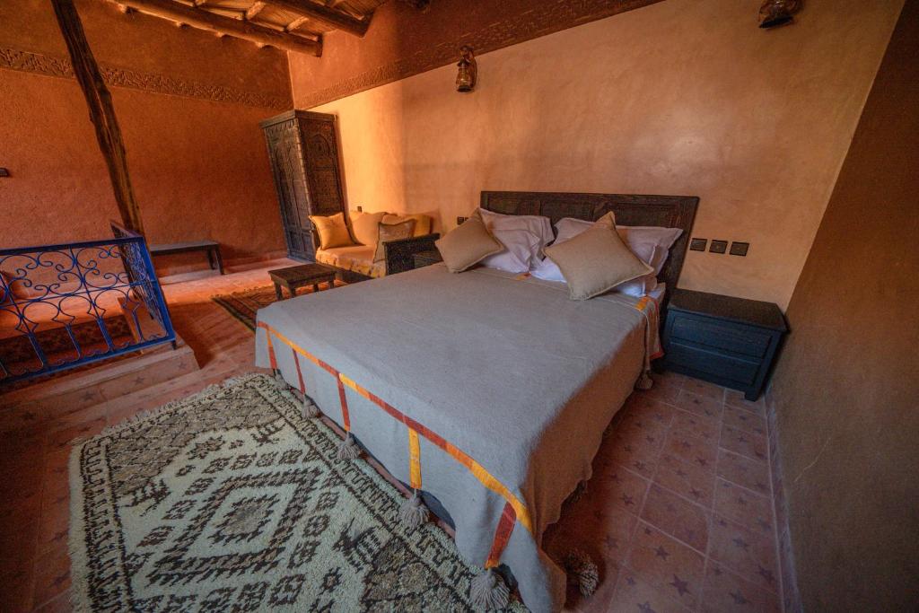 Postel nebo postele na pokoji v ubytování Ouednoujoum Ecolodge & Spa