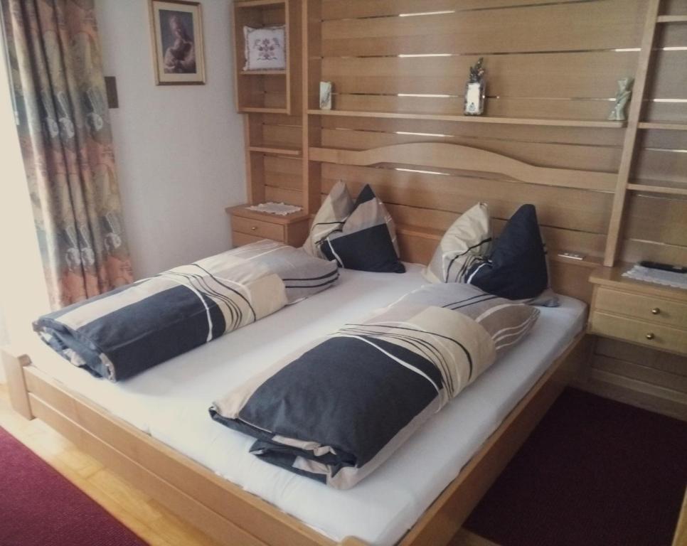 Postel nebo postele na pokoji v ubytování Garni Schwarzenstein