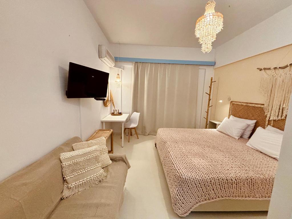 Кровать или кровати в номере Afroditi Junior Suites