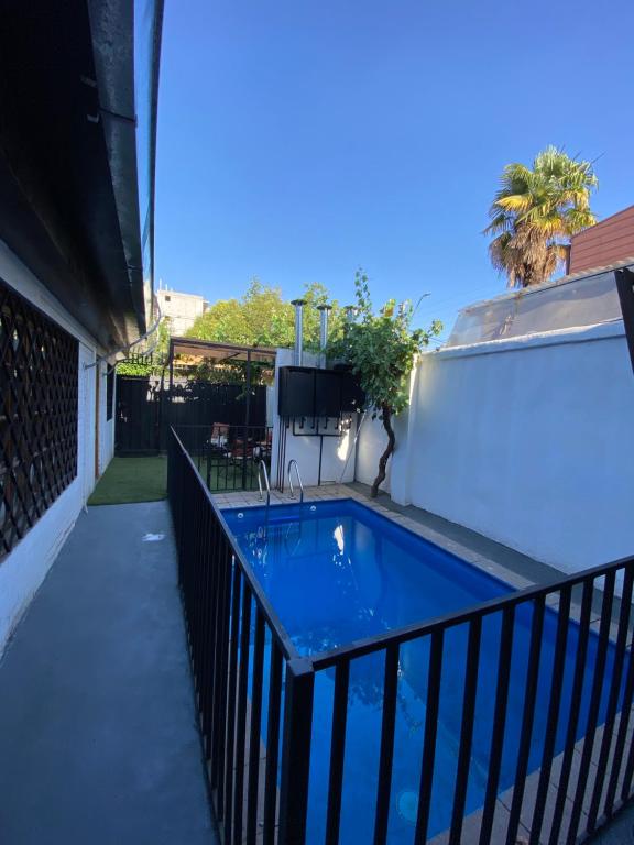 a swimming pool on the side of a building at Casa Guemes in Santiago