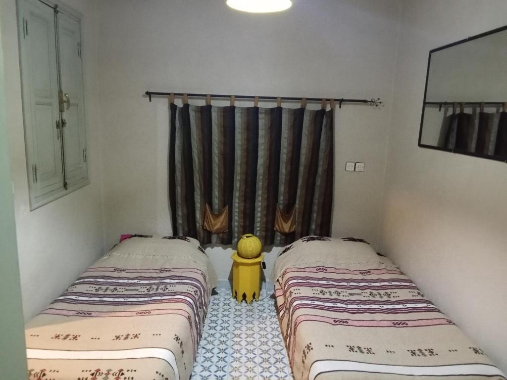 Postel nebo postele na pokoji v ubytování Riad taddert