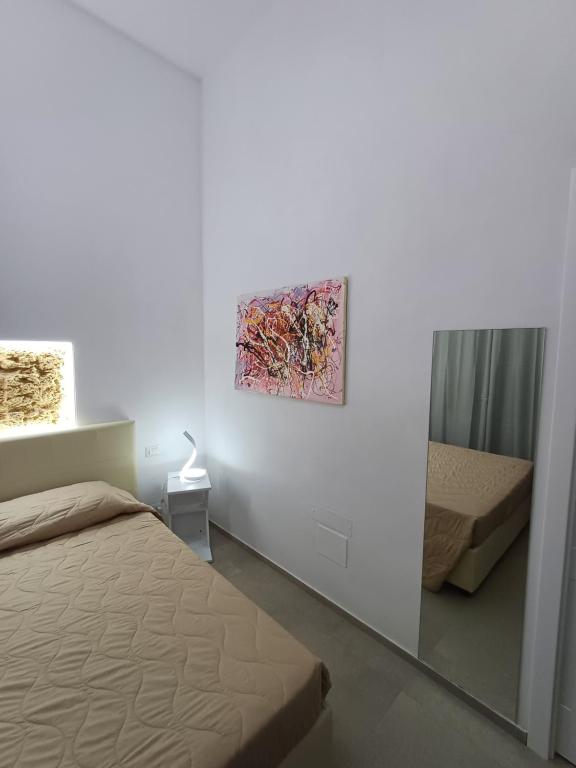 Postel nebo postele na pokoji v ubytování Falìkrjda Suite & Rooms