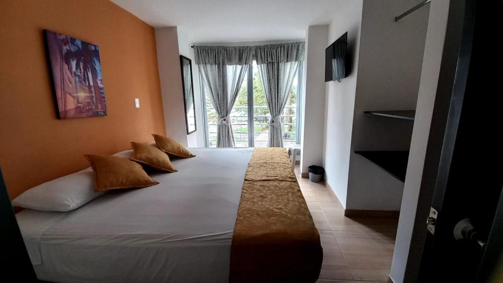 Postel nebo postele na pokoji v ubytování Hotel Anzea