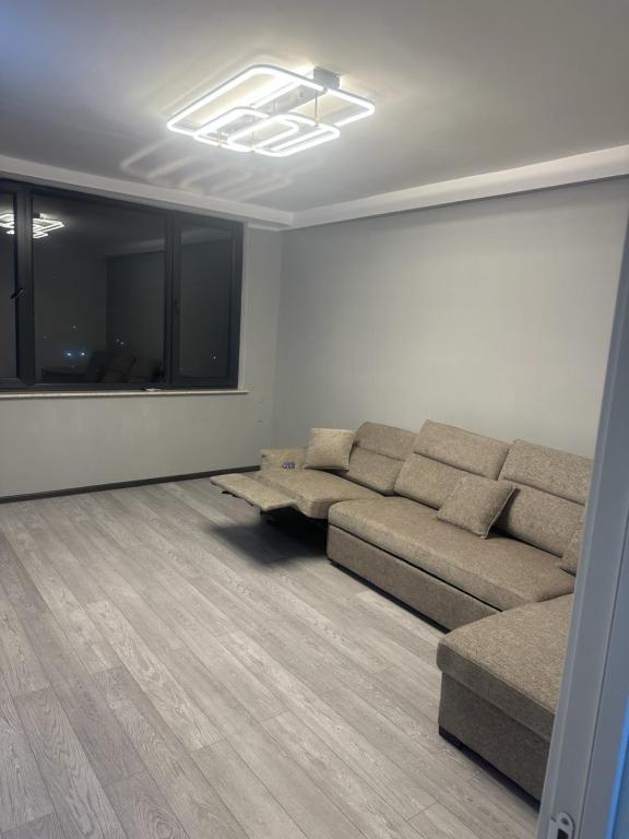 a living room with a couch and a table at Apartment in Yerevan