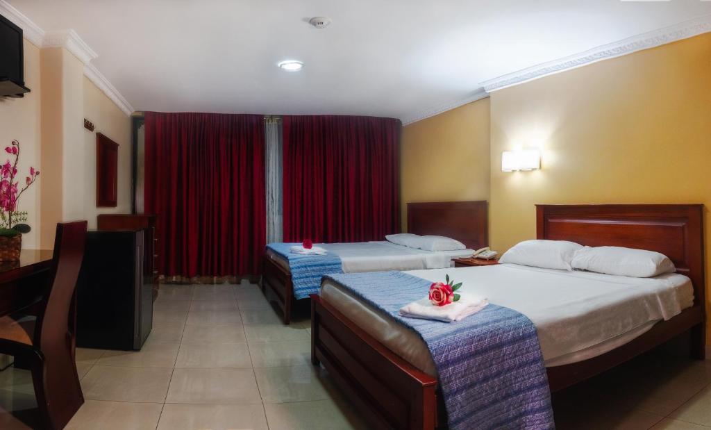 Postel nebo postele na pokoji v ubytování Airport Hotel Guayaquil