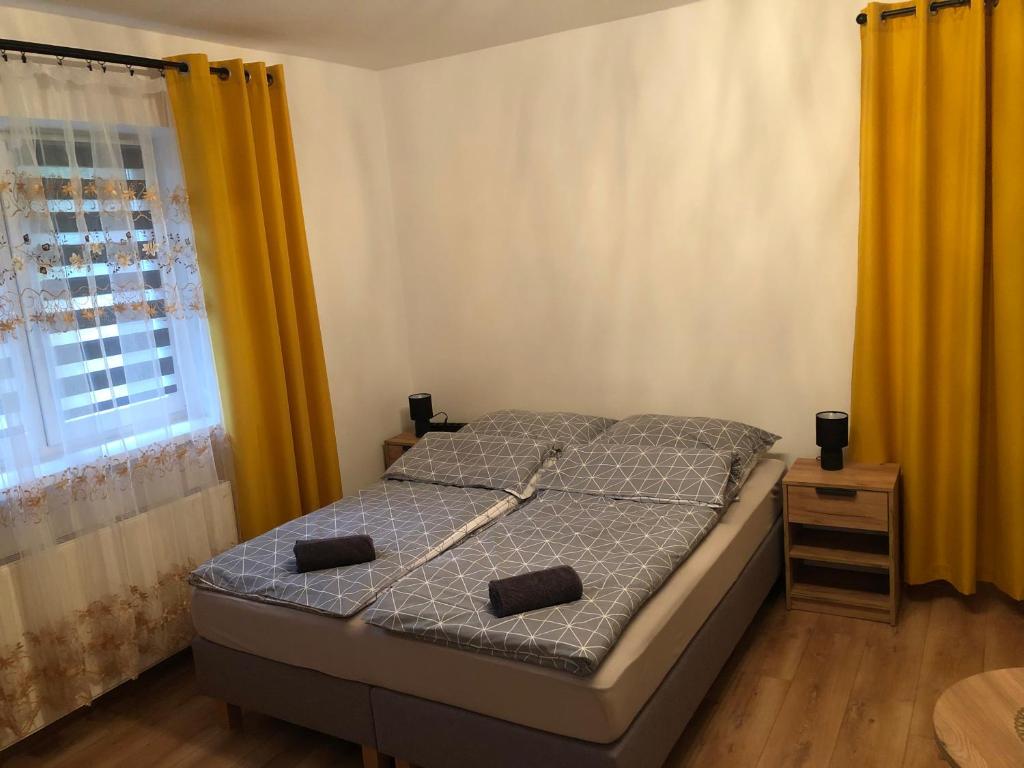 Posteľ alebo postele v izbe v ubytovaní Willa przy Strumyku