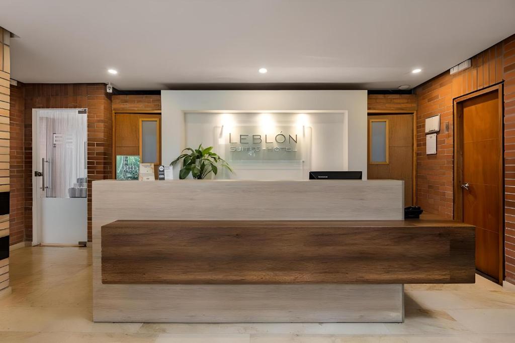 a lobby of a salon with a reception desk at Leblón Suites Hotel in Medellín