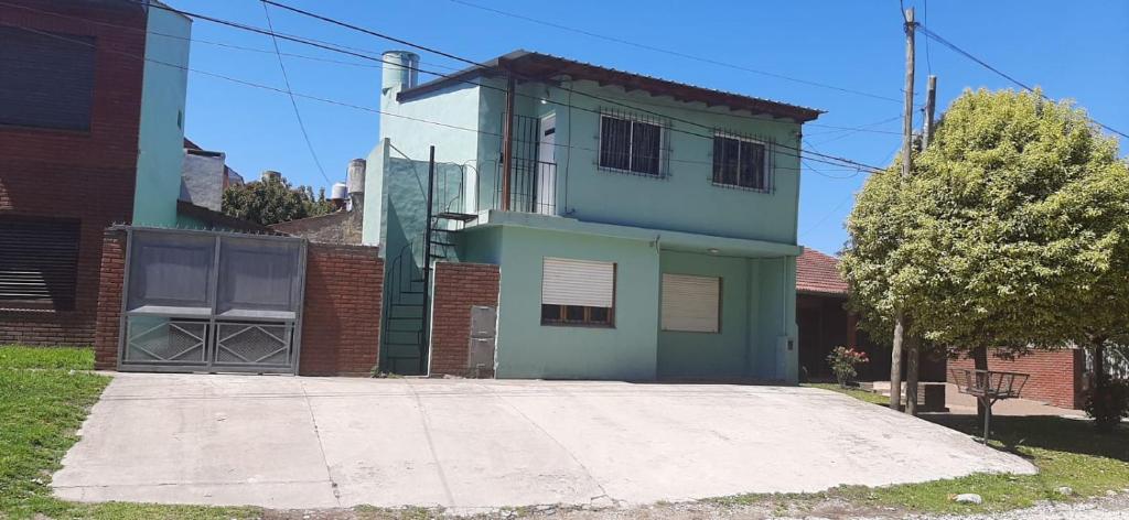 a house with a driveway in front of it at Alícia in Mar del Plata