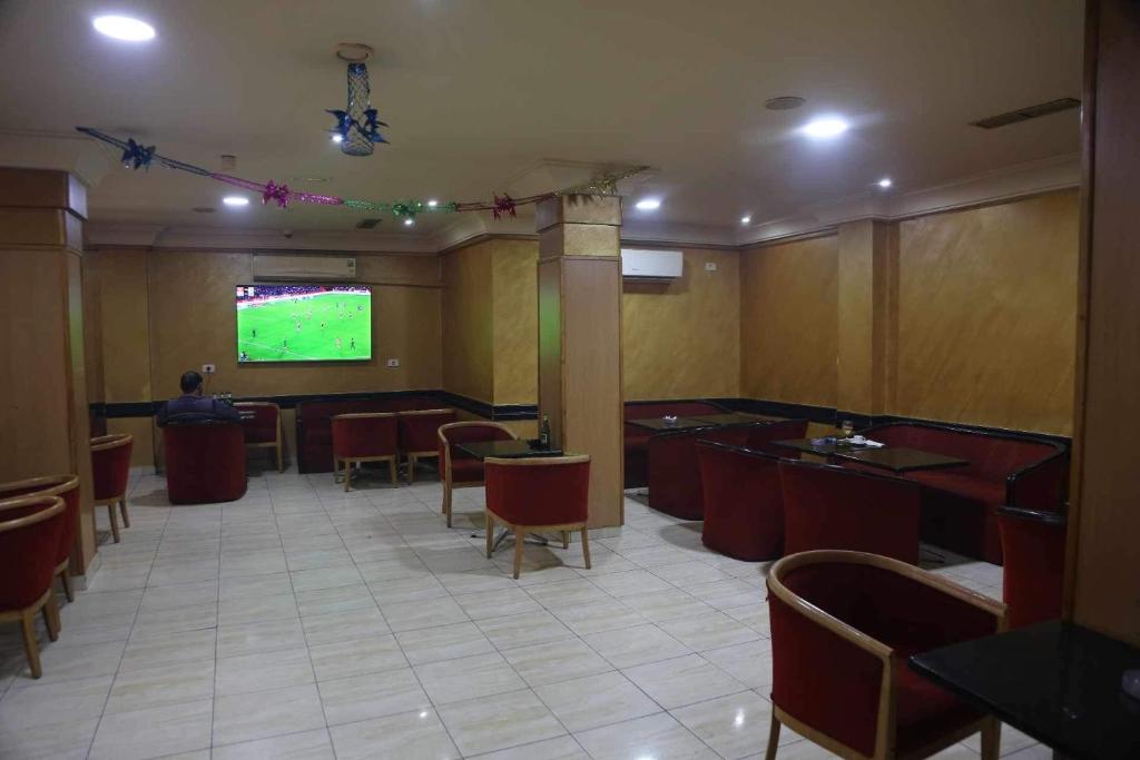 TV a/nebo společenská místnost v ubytování Hotel Amine