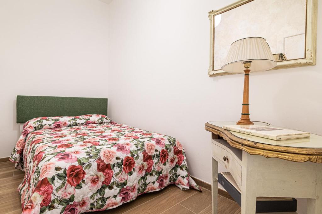 Postel nebo postele na pokoji v ubytování La casa del pittore Squillantini suite