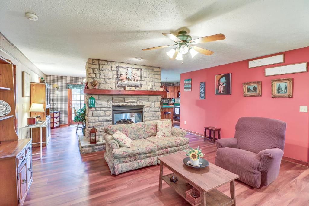 a living room with a couch and a fireplace at Charming Newark Home Less Than 10 Mi to Buckeye Lake in Newark