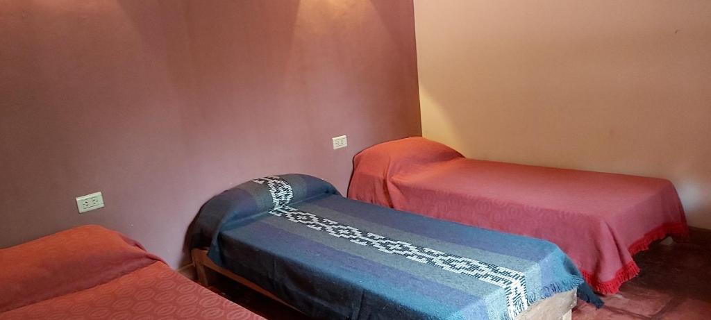 Postel nebo postele na pokoji v ubytování Las Pircas alquiler temporario habitaciones y cabañas