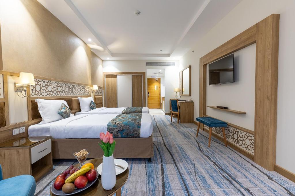 Katil atau katil-katil dalam bilik di TIME Ruba Hotel & Suites