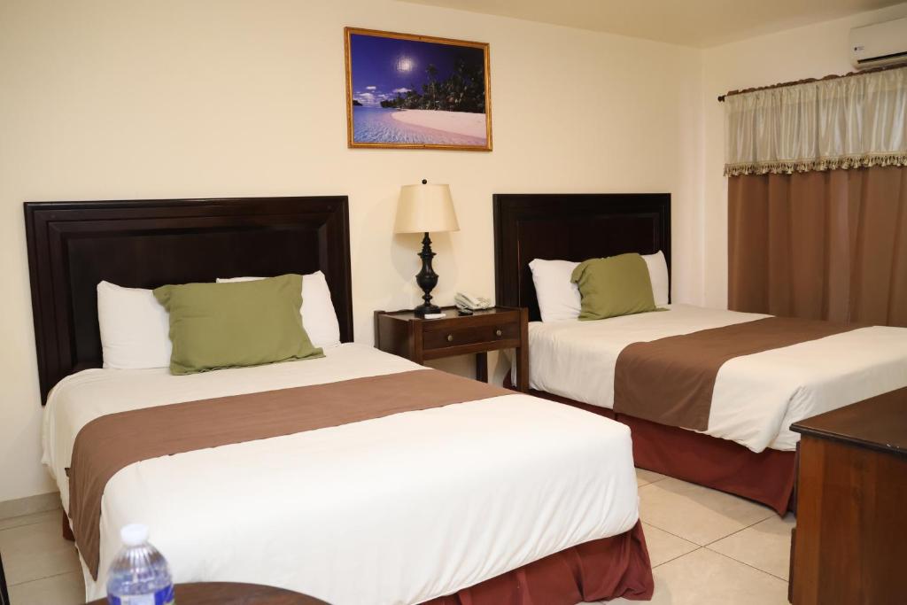 Postel nebo postele na pokoji v ubytování Hotel Partenon Beach