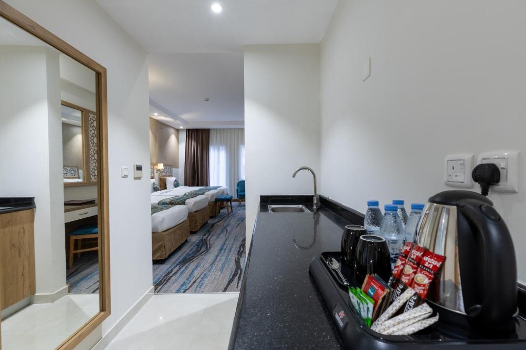 Katil atau katil-katil dalam bilik di TIME Ruba Hotel & Suites