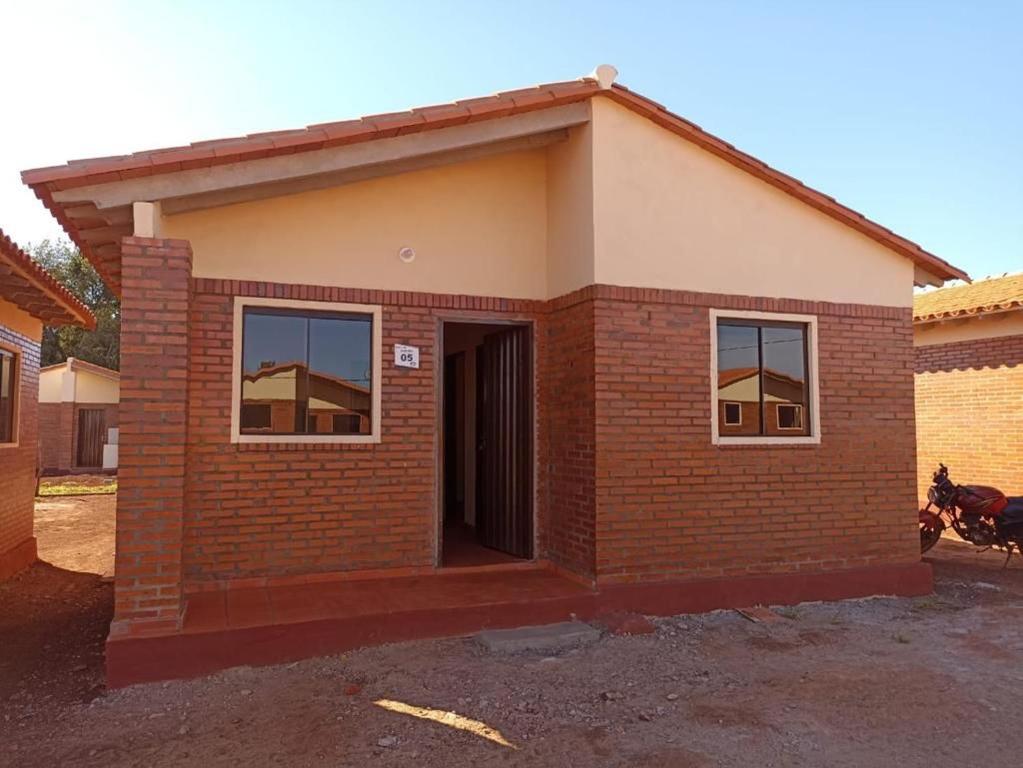 a small brick building with a door and two windows at Tranquillity in San Antonio