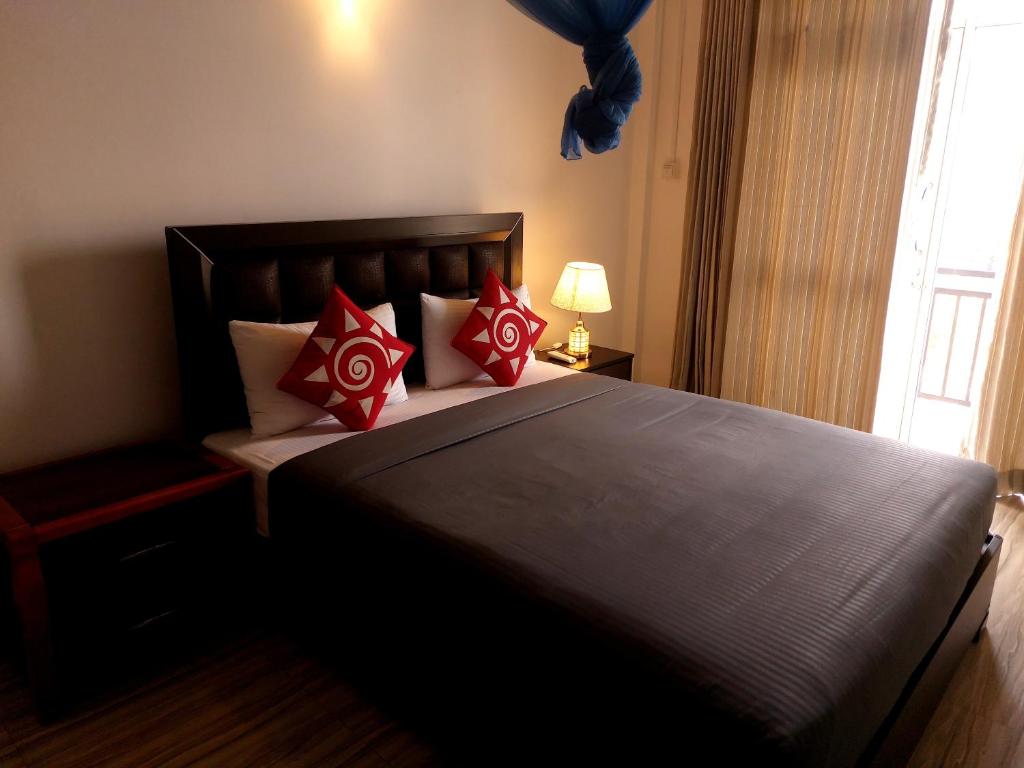 Postel nebo postele na pokoji v ubytování Jaye's Homestay