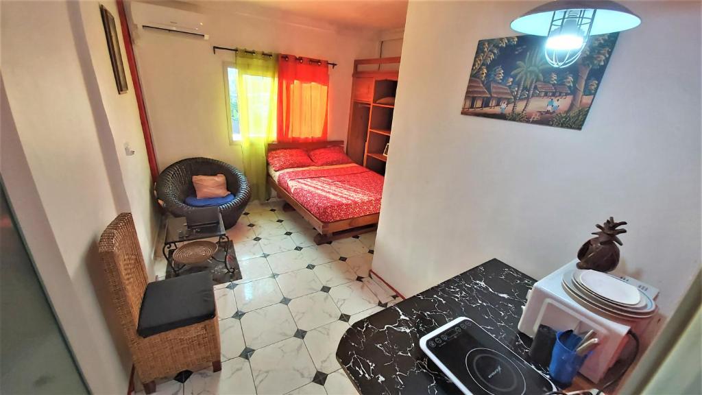 a small living room with a couch and a table at The Yafé Bastos 4 in Yaoundé