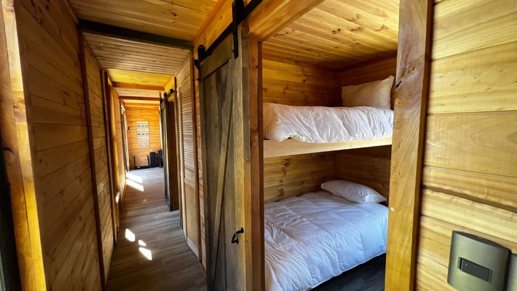 Postel nebo postele na pokoji v ubytování Puerta austral