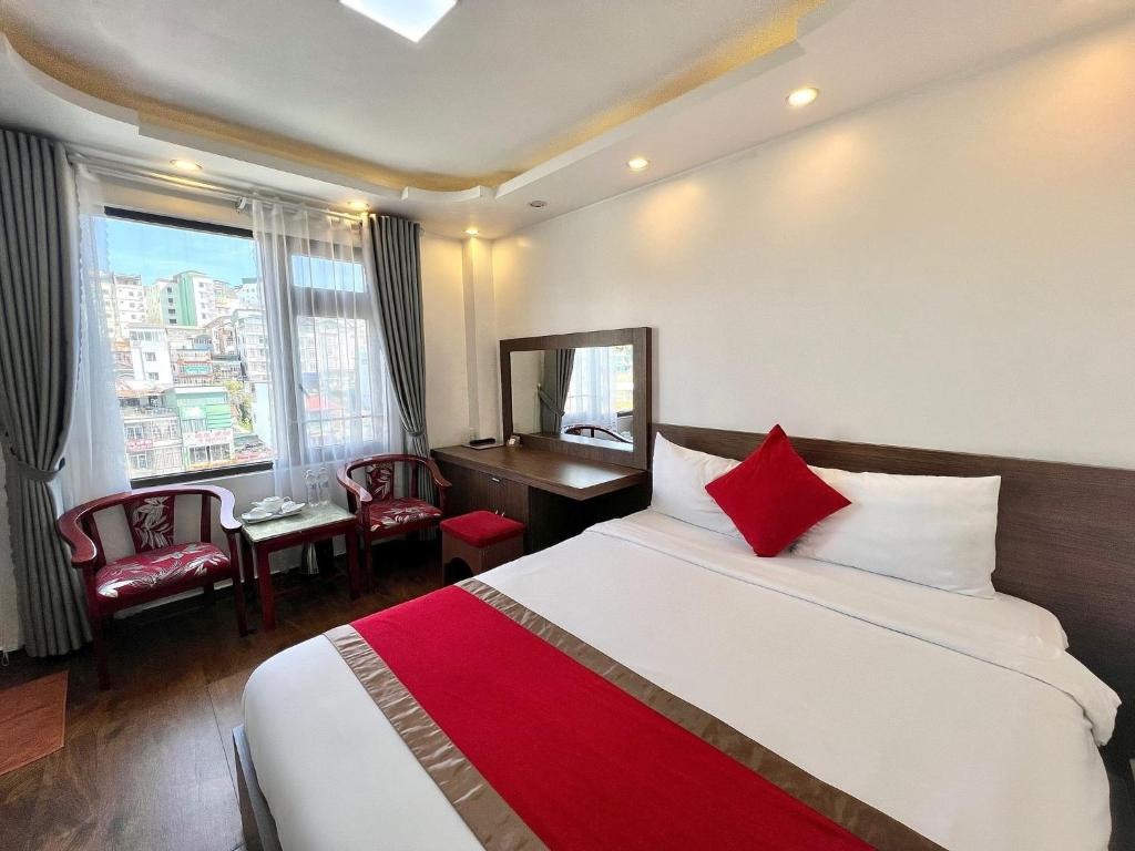 Postel nebo postele na pokoji v ubytování Le Tuan Minh Hotel