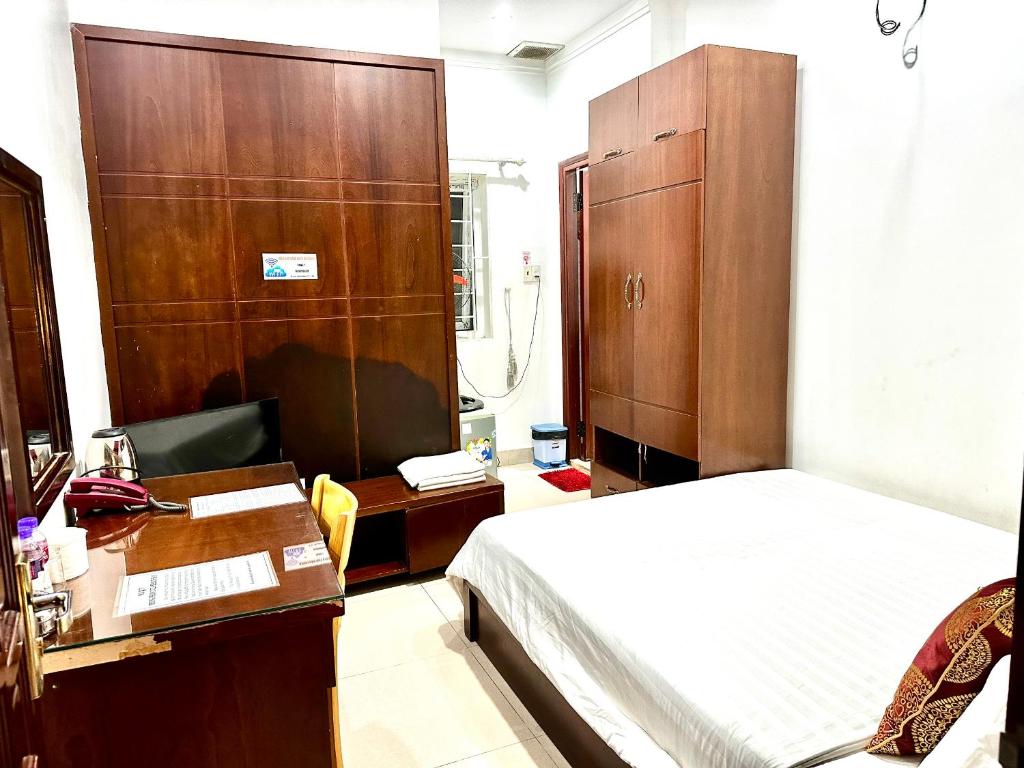 Postel nebo postele na pokoji v ubytování Hoàng Anh hotel