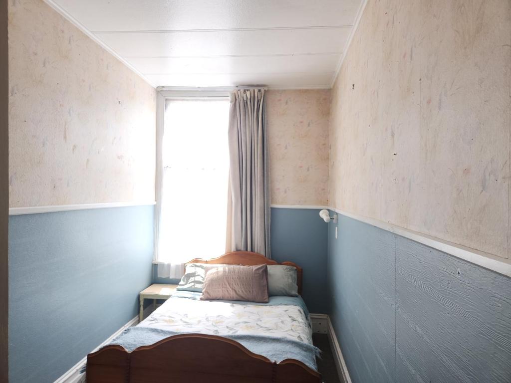Postel nebo postele na pokoji v ubytování Quirky Villa Homestay