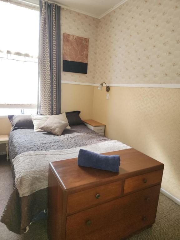 Postel nebo postele na pokoji v ubytování Quirky Villa Homestay