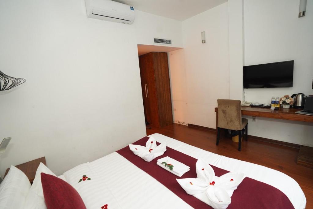 Postel nebo postele na pokoji v ubytování NT Elysian hotel
