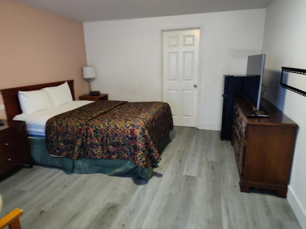 Postel nebo postele na pokoji v ubytování Shamrock Motel