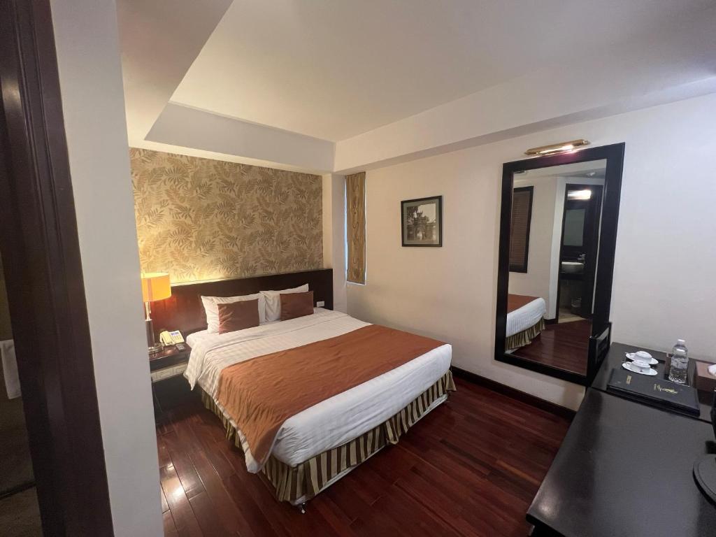 Postel nebo postele na pokoji v ubytování TK123 Hanoi Hotel