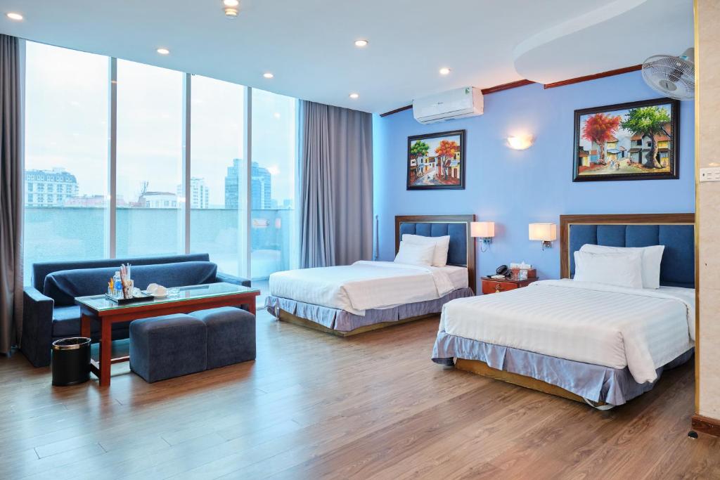 Postel nebo postele na pokoji v ubytování A25 Hotel - 12 Ngô Sỹ Liên