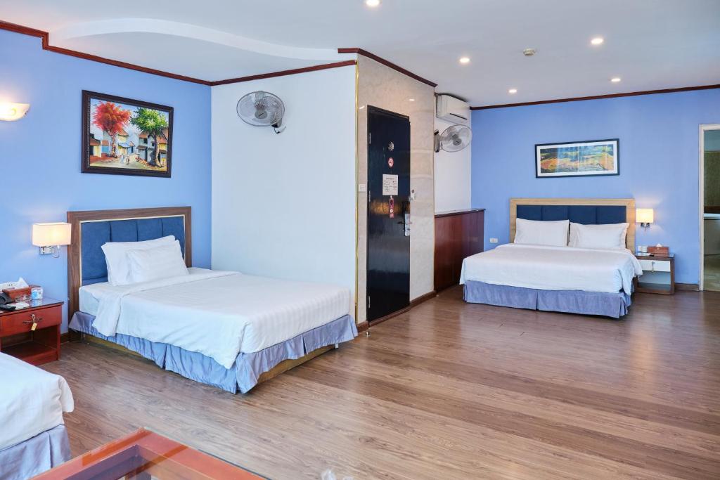 Postel nebo postele na pokoji v ubytování A25 Hotel - 12 Ngô Sỹ Liên