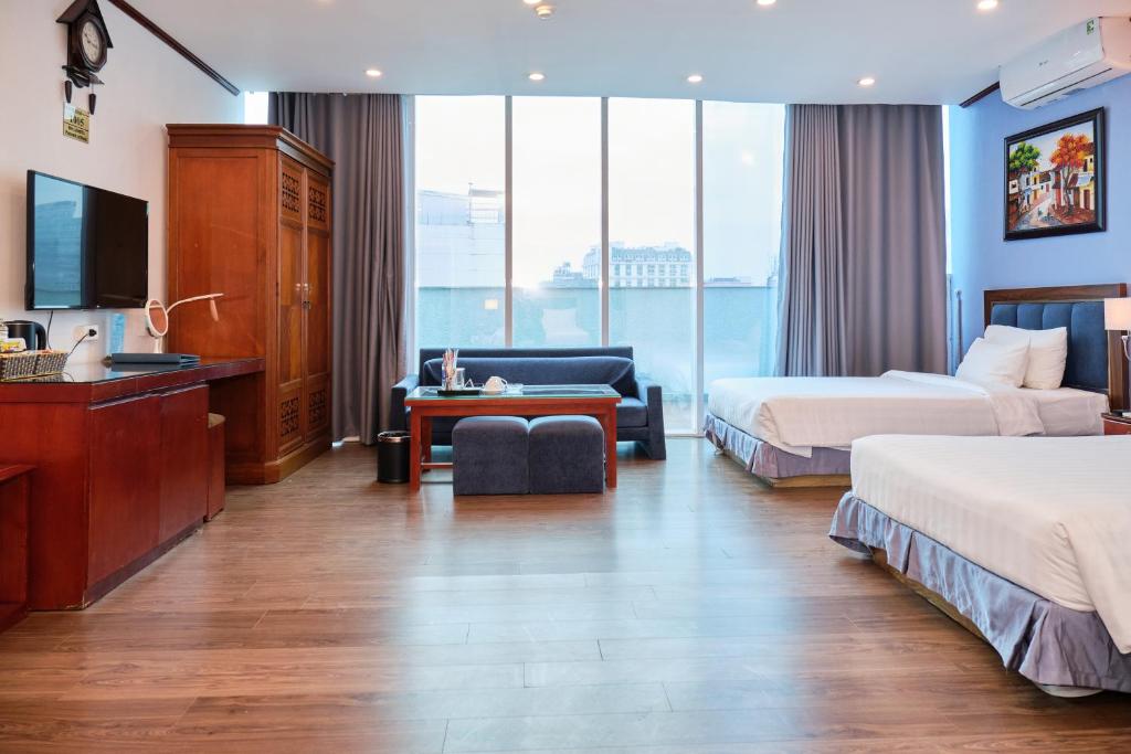 Postel nebo postele na pokoji v ubytování A25 Hotel - 12 Ngô Sỹ Liên