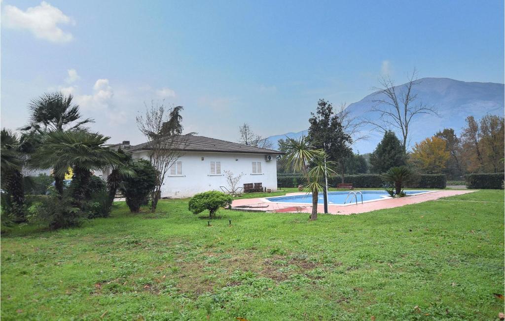 a house and a yard with a swimming pool at Nice Home In Villa S, Lucia With Outdoor Swimming Pool in La Volla